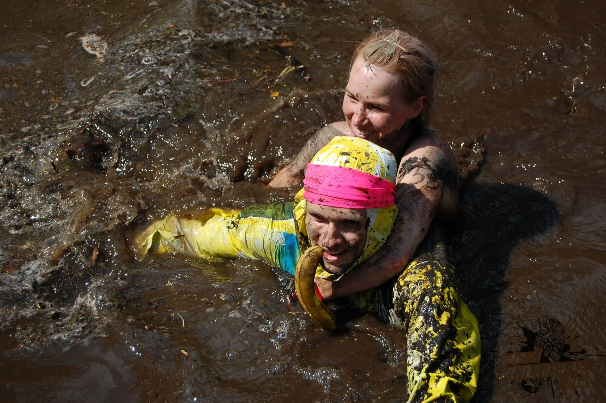 Runners Supporting Each Other at Pajusi Mud Run